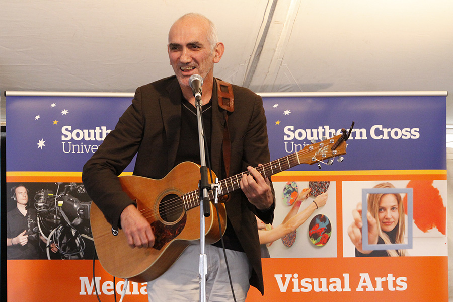 Paul Kelly gives one of his versions of Shakespeare's sonnets a spin for the Saturday afternoon audience. Photo: SCU/Kaleb Smith