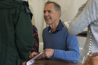 Bob Brown and Paul Thomas signing copies of Green Nomads. Photo: SCU / Natalie Foord