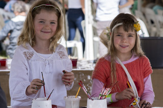 Girls make miniature vegetable gardens at the Farm Kids activity centre. Photo: SCU / Natalie Foord