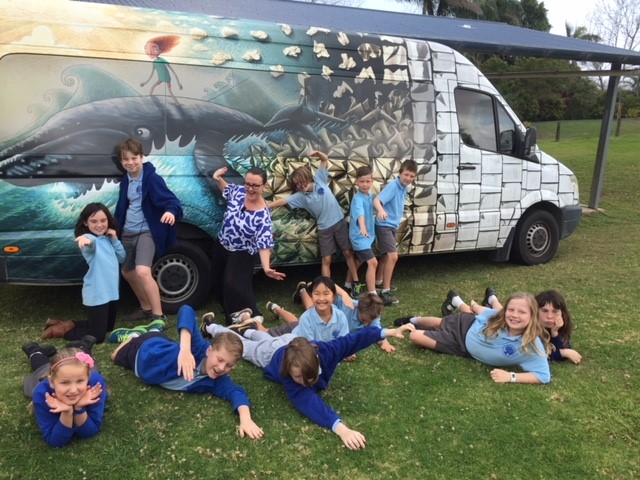 Sam Turnbull with StoryBoard bus and kids